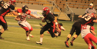 Hunter McWilliams had a big hole to run through on this play on which he gained 38 yards. Philip Spencer at left and Calvin Hinkelman at right can be seen making blocks.