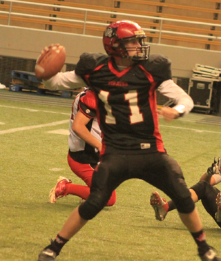 Jake Bruner battled the flu bug but still managed to pass for 4 touchdowns and run for another against Oakley.