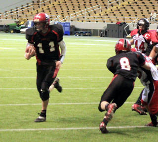 Devin Bruegeman, 8, in for an injured Isaiah Shears, provides a key block on Jake Bruners 11 yard touchdown run.