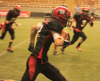 Mason Dalgliesh had a 44 yard kickoff return after Oakleys 2nd touchdown that helped set up an answering touchdown by the Pirates. Also seen are Dally Ratcliff at left and Terran Peery at right.