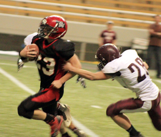 Calvin Hinkelman broke free of this attempted arm tackle for a second quarter touchdown.
