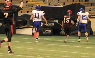 Hunter McWilliams, 15, scores the games first touchdown on a 69 yard catch and run as Rhett Schlader, left, signals touchdown.