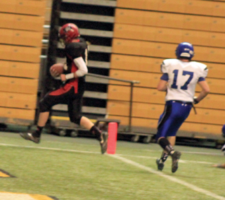 Not only was Jake Bruner near perfect passing the ball but he also scored 4 touchdowns running the ball. Shown is the first of those 4 touchdowns.