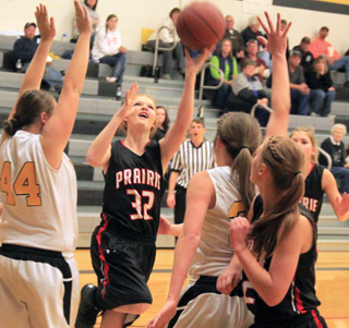 Josie Peery shoots the ball against Highland. Also shown are Sarah Seubert, foreground, and Chaye Uptmor, background.