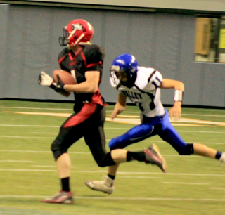 Lucas Arnzen got into the game on offense in the fourth quarter for the first time since leaving the Senior Night game against Kamiah with an injured shoulder. He gained 36 yards on this catch.