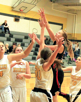 Sarah Seubert puts up a shot against Highland.