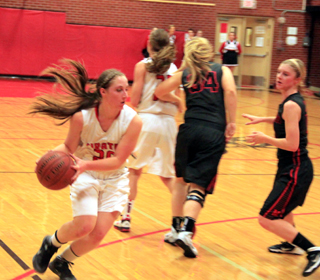 Hailey Danly looks to make a pass into the post after coming off a pick set by Krystin Uhlenkott.