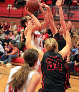 Shayla VonBargen shoots against Moscow. Krystin Uhlenkott can be seen in the foreground.