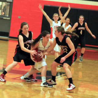 Angela Wemhoff and Krystin Uhlenkott double team Troys ball handler. Shayla VonBargen can be see in the background.