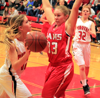 Chaye Uptmor looks to shoot against C.V. At right is Josie Peery.