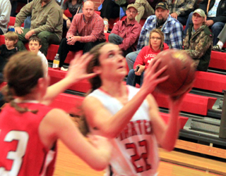 Krystin Uhlenkott goes for a lay-up against C.V.