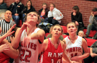 Krystin Uhlenkott looks up to see if her shot is going to go in. At right is Kayla Schumacher.