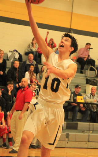Tyler Krogh scores on a fast break lay-up against C.V.