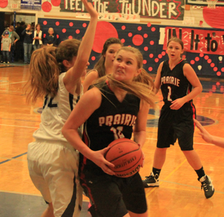 Kayla Schumacher looks for a shot at Grangeville. At right is Tasha Gimmeson.