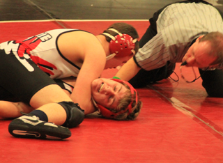 Jace Perrin scores near fall points against his opponent.