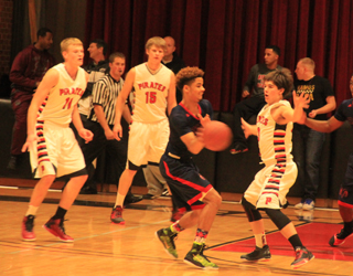 Jake Bruner, Tanner Ross and Terran Peery on defense against Wilson.