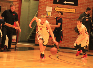 Jake Bruner after a steal heads upcourt at John Mager trails.
