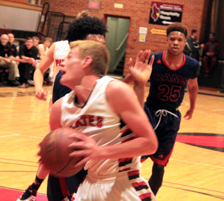 Jake Bruner is able to get past a Wilson defender as he looks to shoot at the Coeur dAlene Tournament.
