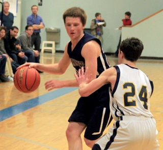 Josh Lustig handles the ball.