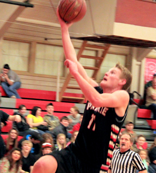 Jake Bruner goes up for what turned out to be a dunk after stealing the ball near the top of the key on the defensive end.