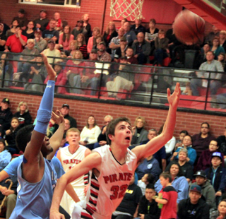 John Mager puts up a shot off the glass against Lapwai. Jake Bruner can be seen in the background.
