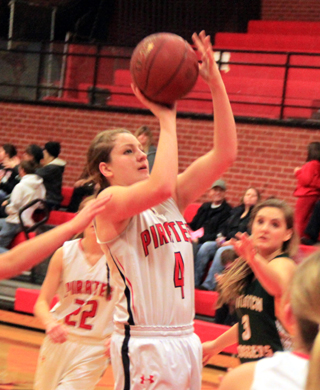 Shayla VonBargen puts up a shot in the Potlatch game. Behind her is Krystin Uhlenkott. At right is Chaye Uptmor.