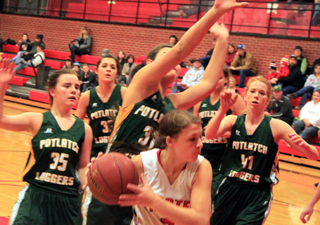 Tasha Gimmeson is surrounded by Potlatch defenders on the low block.
