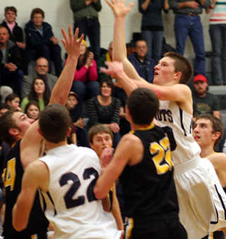 Josh Lustig puts up a shot. #22 is Patrick Chmelik.