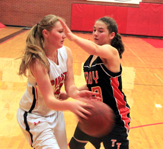Kayla Schumacher makes a pass in Prairies home game against Troy.