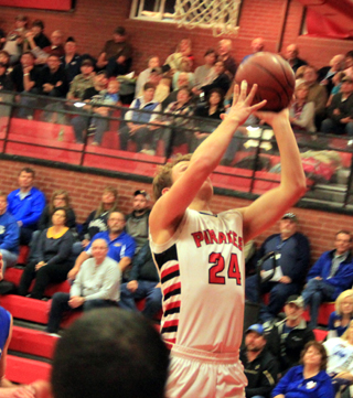 Calvin Hinkelman goes for a basket against Genesee.