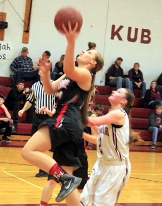 Hailey Danly goes for a lay-up at Kamiah.
