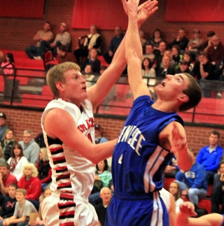 Jake Bruner tosses up a jump hook for a basket against Genesee.