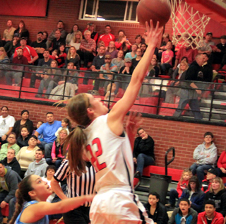 Krystin Uhlenkott scores a lay-up after making a steal against Lapwai. Soon after she picked up her third foul and sat out the rest of the first half.