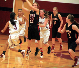 After making a steal Krystin Uhlenkott is about to pass to Angela Wemhoff, right, who scored a lay-up at the other end. Also shown is Kayla Schumacher.