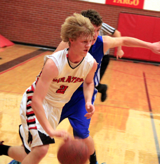 Rhett Schlader drives past a Genesee defender.