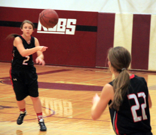 Tasha Gimmeson passes to Krystin Uhlenkott in the Kamiah game.