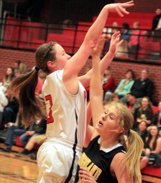 Angela Wemhoff shoots over a Highland defender.