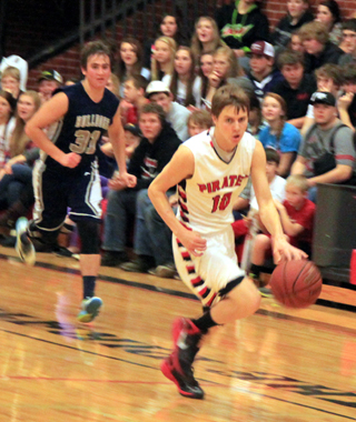 Bryson Higgins drives downcourt after a steal against Grangeville.