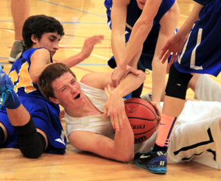 Summits Josh Lustig comes up with a loose ball. Summit called a timeout to avoid a jump ball call.