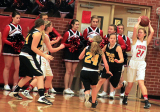 Sarah Seubert steals the ball right in front of the Prairie cheerleaders. Also shown is Chaye Uptmor and cheerleaders Madison Ulmer, Heidi Holubetz, Beth Dinning, Jessi Reiner, Kirsten Latimer and Britney Bianchi.
