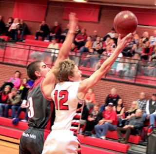 Brandon Higgins goes for a lay-up following a steal.