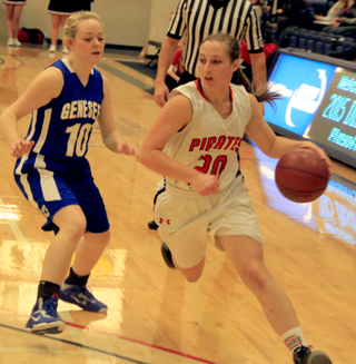 Hailey Danly drives past a Genesee defender at District.