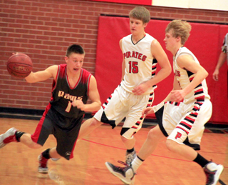 Tanner Ross and Rhett Schlader force a C.V. player to try and dribble away from a possible trap.