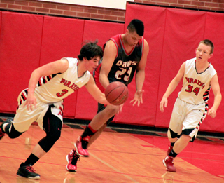 Terran Peery knocks the ball loose on defense as Devin Bruegeman watches.