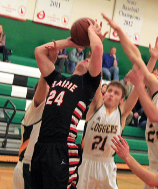Calvin Hinkelman gets fouled as he goes for a basket at Potlatch.