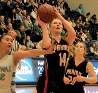 Kayla Schumacher appears to get fouled on this shot against Lapwai. Hailey Danly watches from behind.