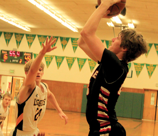Lucas Arnzen puts up a jump shot at Potlatch.