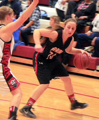 Hailey Danly handles the ball against Challis. If you look close you can see the shiner she picked up under her left eye in the Liberty Charter game.
