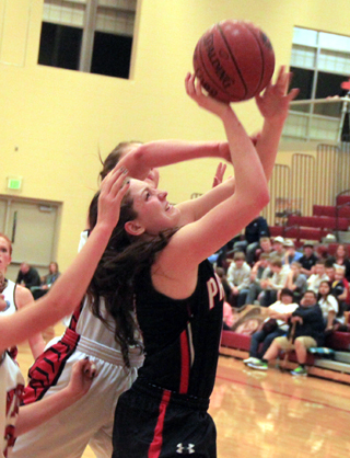 Shayla VonBargen tries to shoot in the Challis game.