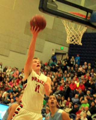 Jake Bruner goes for a lay-up against Lapwai.